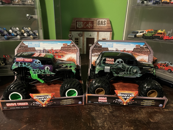 Two monster trucks called Grave Digger from the Monster Jam series of trucks made by Spin Master.