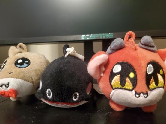Mongo the landshark, the local aquarium whale, and emotional support demon hanging out on my computer.