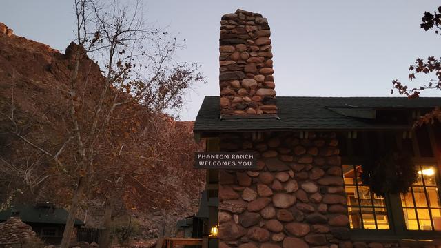 Sign on stone building says "Phantom Ranch Welcomes You"