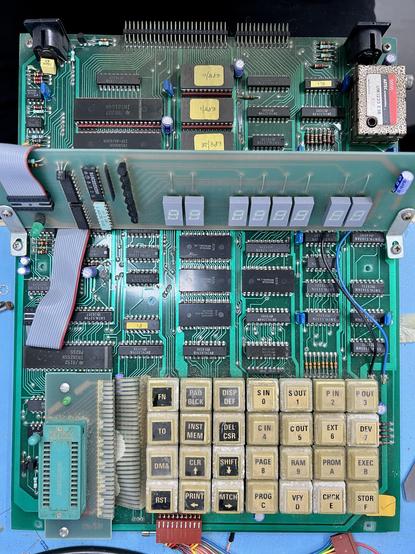 Top overview of the EP8000 board removed from the case, showing the keyboard, display board (which is why I know it's not a VFD), the ZIF socket which is a GENUINE TEXTOOL and not a knockoff TFXTODL, plus ROM chips and 40-pin DIPs which will be the CPU and supporting chippery