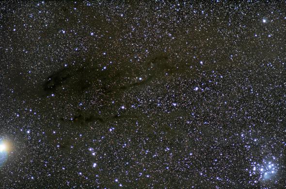 The winter Milky Way, mostly in Taurus. Dark dust clouds lace across rich star fields.

Lower left corner is brilliant Jupiter. Lower right corner is the star cluster the Pleiades and some of their light blue reflection nebula.

Upper right corner is the star Menkib (ξ Persei)