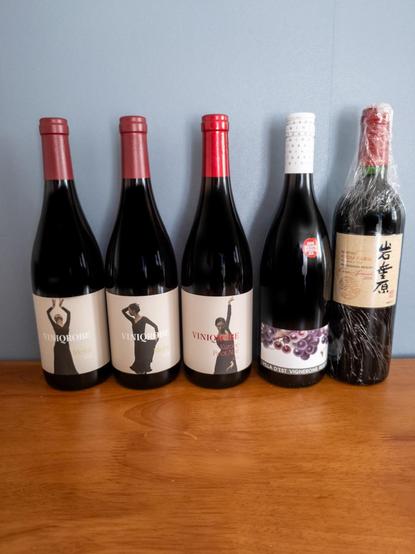Five wine bottles