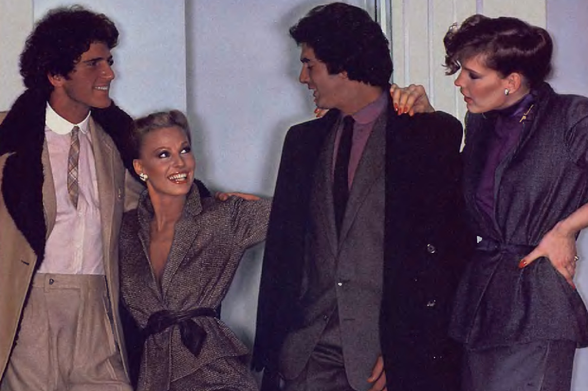 1979 Four Individuals in Professional Attire, Smiling at Each Other

The image features four individuals standing close together and smiling towards the camera.
They appear to be dressed for a professional or semi-formal event.