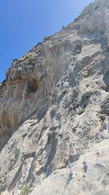 A part-sunlit, part-shadowed, grey, limestone face, slab at the bottom and top with a steep/overhanging section at the edge of a shallow overhanging cave. A climber in yellow and orange is high on the route, attempting to move over the lip at the top of the overhanging section.

I don't get climbing in other countries much and in April I got to go back to the fabulous sport climbing paradise of Kalymnos. This route at Cave, Zizanie, was one of the hardest on the holiday and definitely the hardest I've fought to onsight a route. I was especially proud of myself for not giving up - I tried the pictured section probably over a dozen times, retreating to a semi-rest on the overhang with each failure until I finally worked it out. It felt like it took hours.