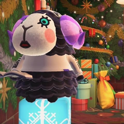 Animal Crossing: New Horizons screenshot. Image shows Muffy (black sheep with purple horns) sitting on a light up block that has a custom design that looks like a snowflake with a large Christmas tree and a stack of presents behind her.
