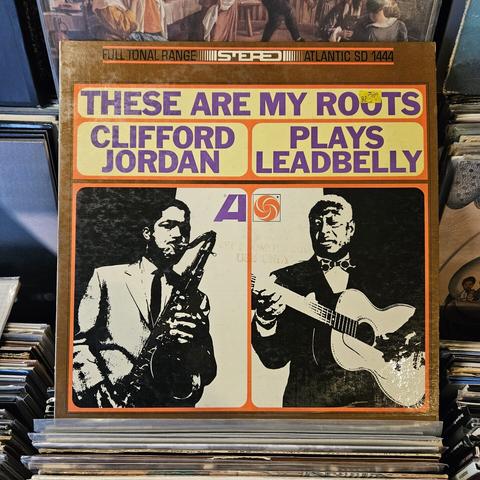 Album cover features two black and white photographs side by side: CJ on the left and Leadbelly on the right.