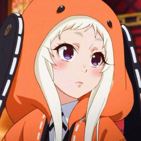 runa from kakegurui. she wears an orange dog onesie, has blond hair, and purple eyes. i’m pretty sure she’s 14 or maybe 16 (?) in the show