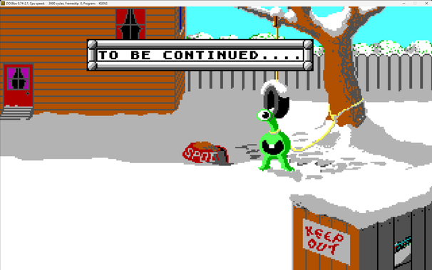 Ending screen of Commander Keen 2. A one-eyed alien is hitched to a tree behind Keen's house. "To be continued" is displayed in a text box.