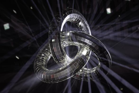 A mirror ball made from three circles, with lots of fine beams of light.