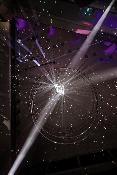 The mirror ball at 38C3 viewed from below. The spots on the ceiling look, like a sky of stars.