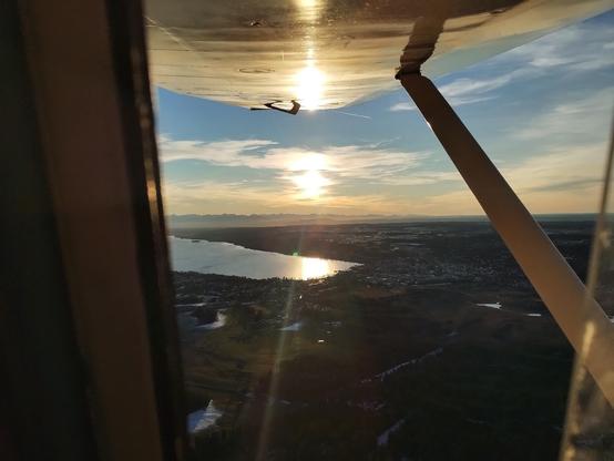 View from plane to the left again. Setting sun above Lake Starnberg.