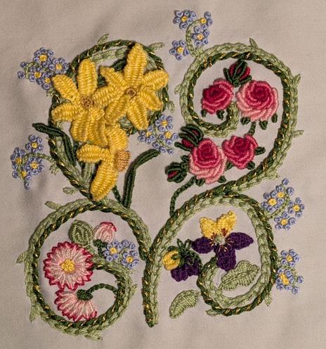Stumpwork embroidery featuring vines and flowers