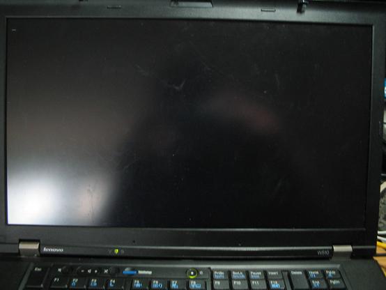 A ThinkPad W510 laptop with the "black screen of death" having only a blinking cursor