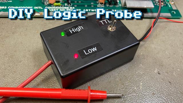 Thumbnail for my video. A self-made logic probe in a black project enclosure on my workbench. A red probe from a cheap multimeter is connected to the box which has a green "high" LED and a red "Low" LED plus a switch that is labelled "TTL". In the background, there's the edge of a circuit board which the logic probe is connected to. The overlayed text reads "DIY Logic Probe".