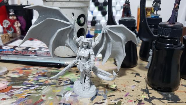 Reaper miniatures bones Queen of Hell mini dry fitted together on my messy paint desk.