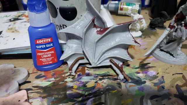 The Queen of Hell's wings with copper wire glued to them.