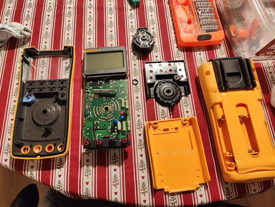 Fluke digital multimeter. Disassembled and laid out. Looks clean.
