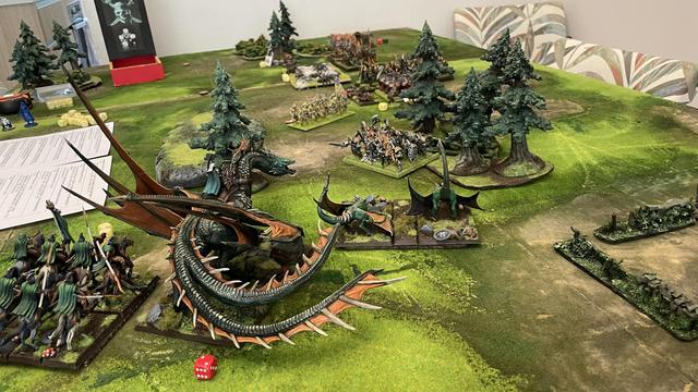 The eleven dragon led battle line bears down on the rear of the Abyssal forces. Many models lined up already in combat.