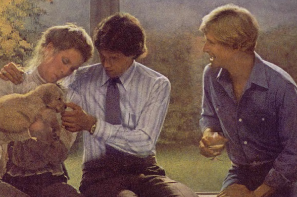 1978 A Group of People Sitting and Interacting with a Dog

Description: The image portrays four individuals seated outdoors, engaging in what appears to be casual conversation. In the center of their interaction is an adult dog that seems to have captured everyone's attention as they pet it or hold onto its leash.
