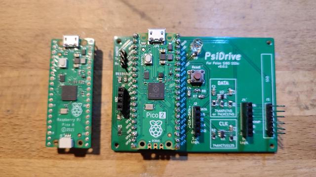 Photo of the PsiDrive 0.0.1 with a Pico2 board fitted. To the left is an original Pico.