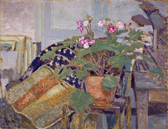 A painting of the Nabi school. A potted plant with purple flowers is on a stand. Behind it is a heap of patterned fabric; beyond that, to the left, a series of canvases leans against the wall. To the right we can see a piano. This is evidently in the artist's studio; rather than seeming formally arranged, it has a casual air, like a photograph.