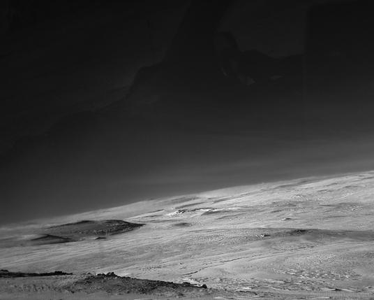 another stark snowy landscape that almost looks otherworldly in black and white