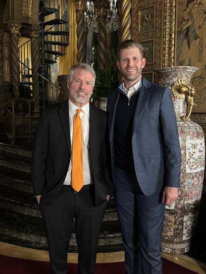 a photo of Michael Saylor and Eric Trump hanging out
