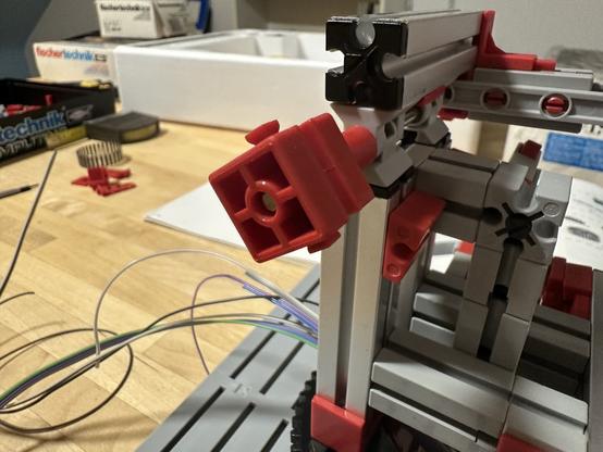 The party assembled robot with a hinge part barely fitting on the axle.