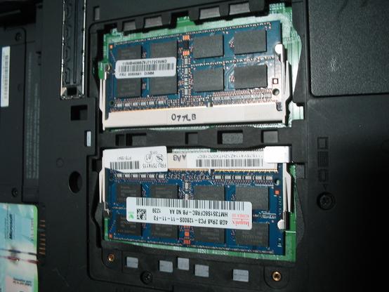 Two 4GB DIMMs installed in the DIMM slots underneath a ThinkPad W510. The DIMMs were saved from a previous ThinkPad that was upgraded to 8GB DIMMs.