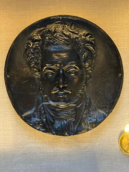 frontal view: man with mustache in the garb of the era

David produced many portrait medallions to honor great contemporaries and some recent figures. Typically, they included a facsimile of the subject's signature to add verisimilitude. In this case, there is instead just the inscription, Uriah P/Levy/of the united/states-navy at left

Reinis # 291
1833 c. 17-18 cm.