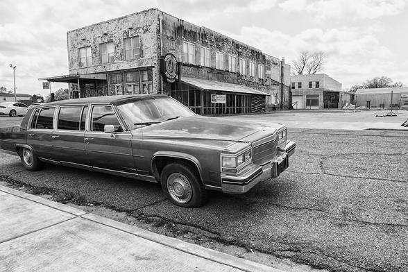 Old limousine in front of Morgan Freeman's Ground Zero Blues Club in Clarksdale, birthplace of the Blues, Mississippi, USA in black and white