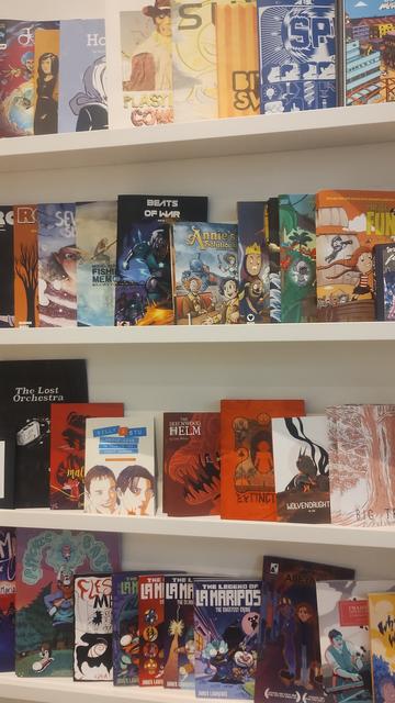 Shelves of mini-comics by local Scottish creators in La Belle Adventure bookshop