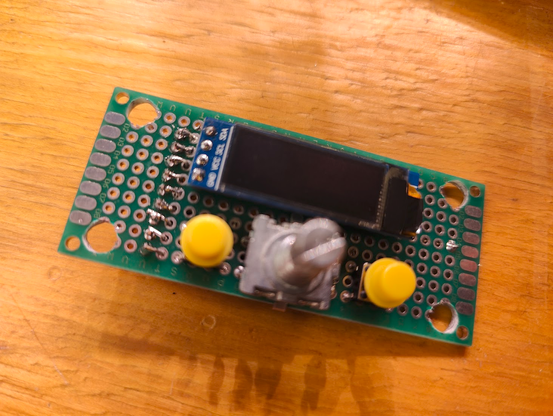 Closeup of the control panel PCB. Contains two buttons, a rotary encoder and a 128x32 OLED display.