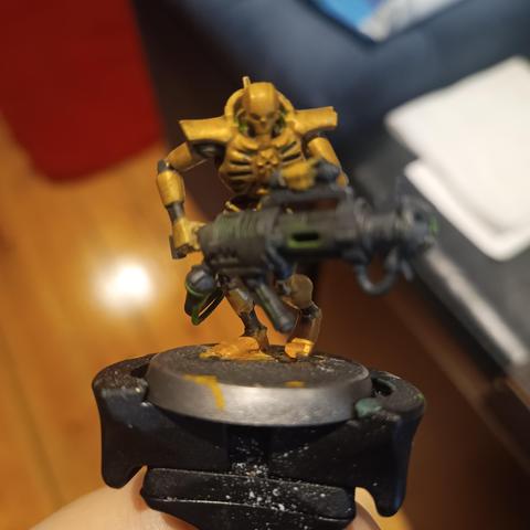 A Necron Immortal painted with Green Stuff world paints instead of Citadel or Vallejo. I didn't like how this turned out at first, but it is growing on me.