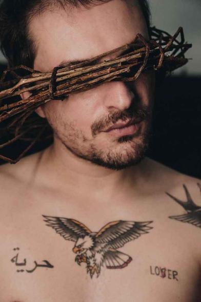 tree twigs covering the man s eyes