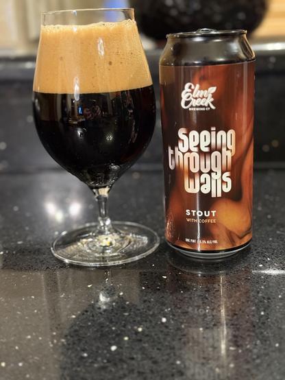 A tall snifter glass with dark beer and a big thick tanned. The pint can is swirled in shades of brown, like creamer clouds in your coffee. Lettering for the beer name and brewery is white.