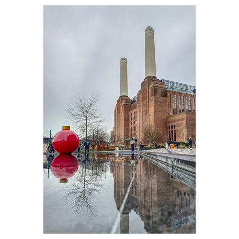Colour photo of Battersea Power Station and its reflection in the pools outside