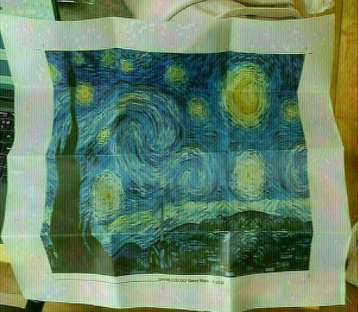 van gogh's starry night printed on 2.92 DCF.  no transparency. it's a rectangular shape, around 40*50cm, and we can see where it was folded. mess in the background