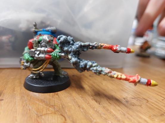 Ork commando shooting Rockets with massive smoke trails