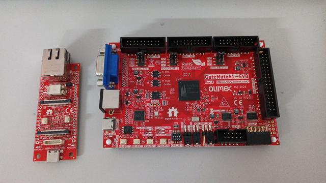 Two red development boards from Olimex. A small one for the ESP32-P4 and a larger one for the CologneChip GateMate A1