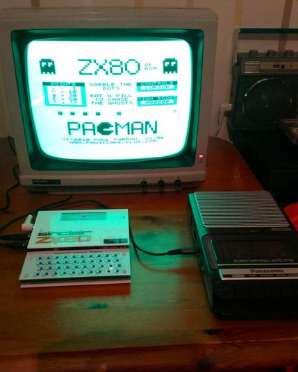 Title screen of PacMan on the ZX80 clone computer (Minstrel 2). It is being displayed on my vintage Philips green screen CRT monitor. In front is the computer and next to that is my cassette recorder which was used to load the game into the ZX80.