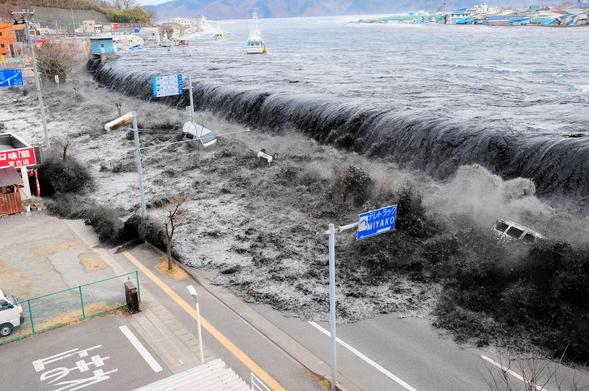 photo - water flooding on to land after an earthquake, Japan