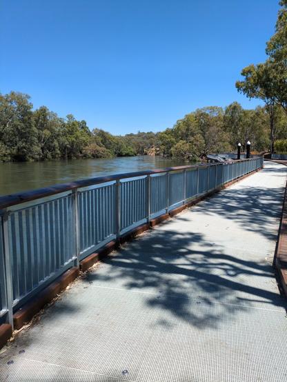 A popular cycling and walking path along the edge of the Murray. This section is built over the river itself, with small steel fence to stop people falling in.