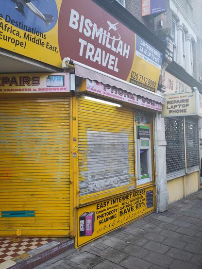 Shopfront for a travel agent called 'Bismillah Travel '.