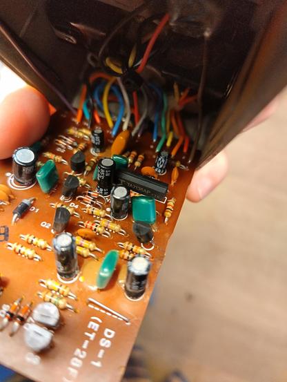 Photo of the inside of a Boss DS-1 with the TA7136AP IC in the middle.