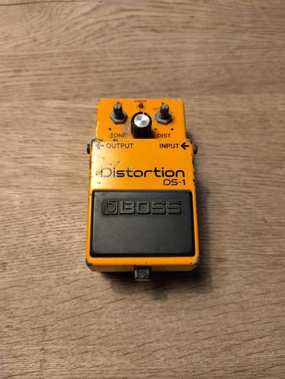 Photo of a Boss DS-1 guitar effect.
