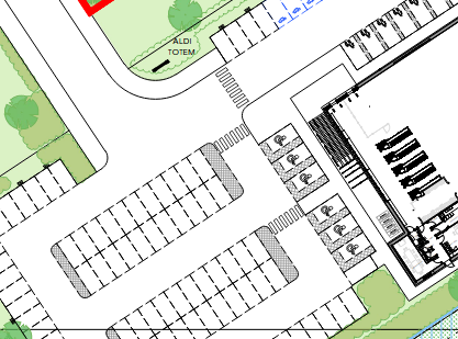 partial plan of a car park, showing the cycleway entering from the top left, to the left of a road, but then with no zebras or nothing to reach the cycle parking across the car park on the bottom-right of the building.