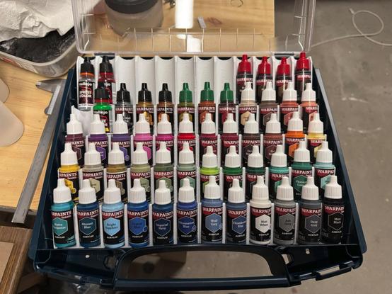 An Sortimo iBoxx72 with a range of Army Painter Warpaint Fanatic bottles inside it. The bottles are organised in a 3d printed storage system, allowing up to 60 bottles inside one case.