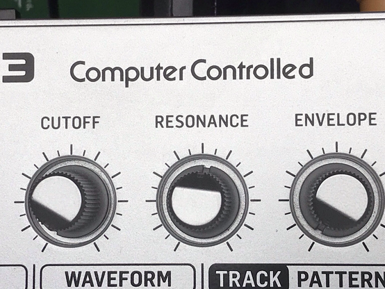 Closeup on the cutoff, resonance and envelope knobs of that famous acid box. Or any clone.