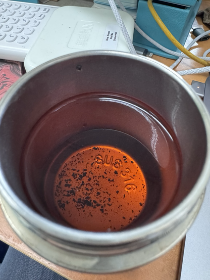 golden brown brewed tea in a sensible steel thermos.